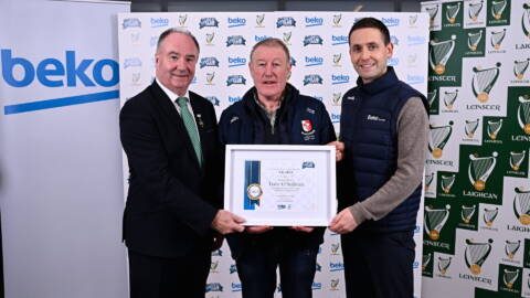 Tony O'Sullivan of Sarsfields GAA, Kildare, receiving his award from Cathaoirleach Comhairle Laighean Derek Kent, left, and Beko Ireland Marketing Manager Shane O'Connor