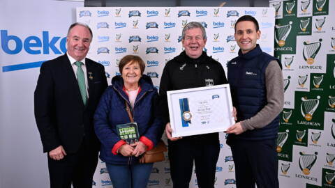 Kevin Roe of Clara GAA Club, Offaly, receiving his award from Beko Ireland Marketing Manager Shane O'Connor, right, and Cathaoirleach Comhairle Laighean Derek Kent, left, alongside his wife Kay