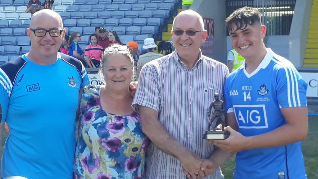 Man of the Match Luke Swan pictured with his parents and Paul Dempsey from sponsors, Electric Ireland